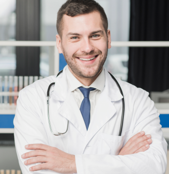 Male Doctor Standing With Stethoscope