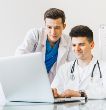 Doctors Working on Laptop